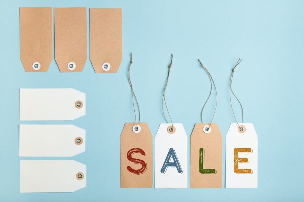 Set of tags with word SALE on a blue background. Seasonal discounts in stores